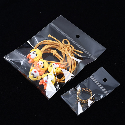 Transparent self-adhesive plastic pouch with hanging hole for nail accessories, long strip card head bag, airplane packaging bag for wholesale