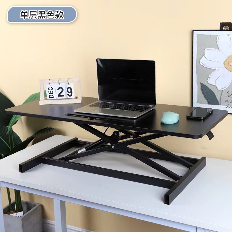 気動机の上のコンピュータの机は立式の事務室の台の上に立って高くなるノートの折り畳みの机で机を昇降することができます。
