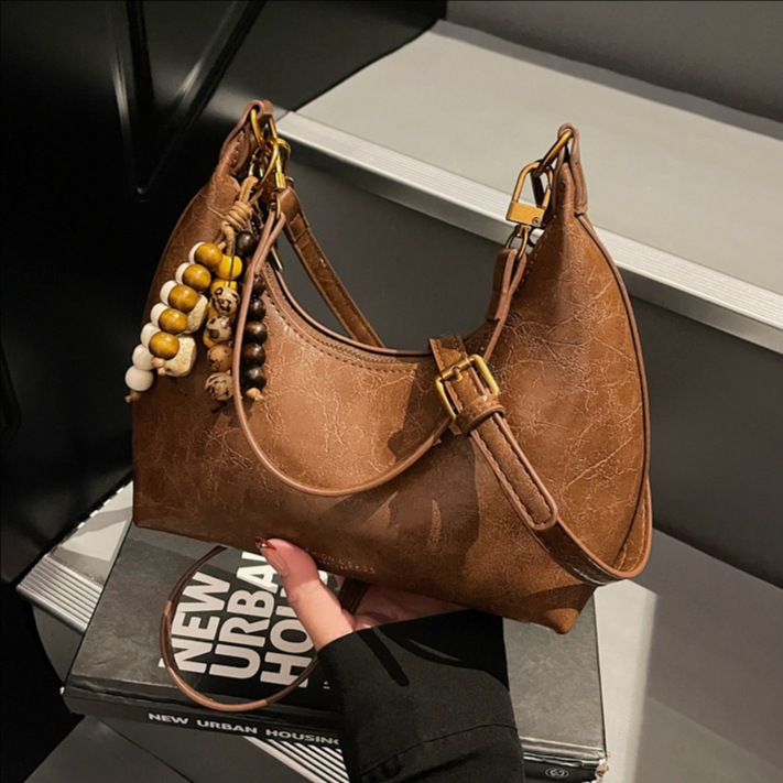 Bolsa de cuero suave retro, bolso de brazo de mujer de estilo extranjero, bolso de hombro de un solo hombro, 2025 nuevo bolso de mano.