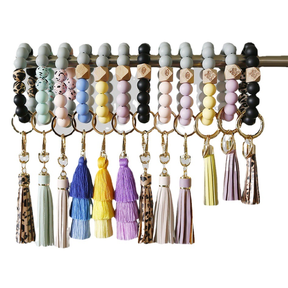 Amazon europeo y americano popular silicona muñeca llavero hecho a mano con cuentas de cuero borla pulsera al por mayor