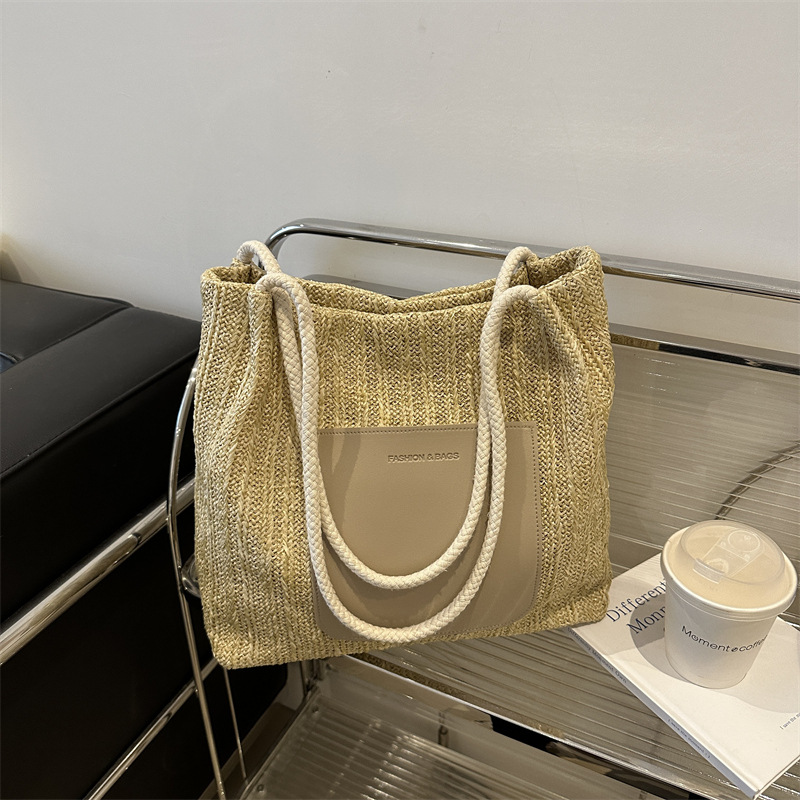 Popular bolsa de tejido de gran capacidad para mujeres 2024 verano nueva bolsa de hombro universal bolsa de viaje de moda