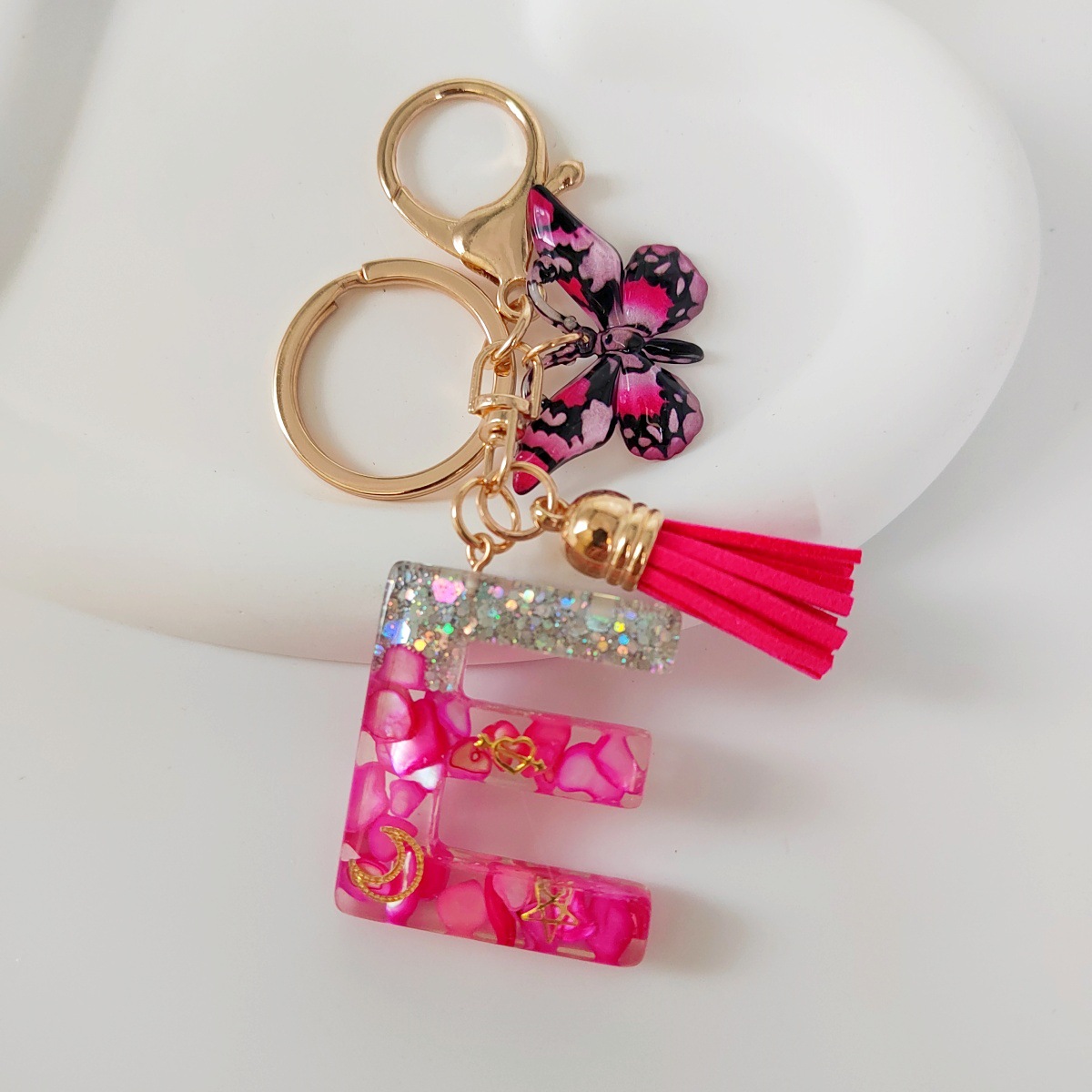 Inventario transfronterizo nueva resina bicolor mariposa borda llavero colgante estrella luna accesorios de joyas