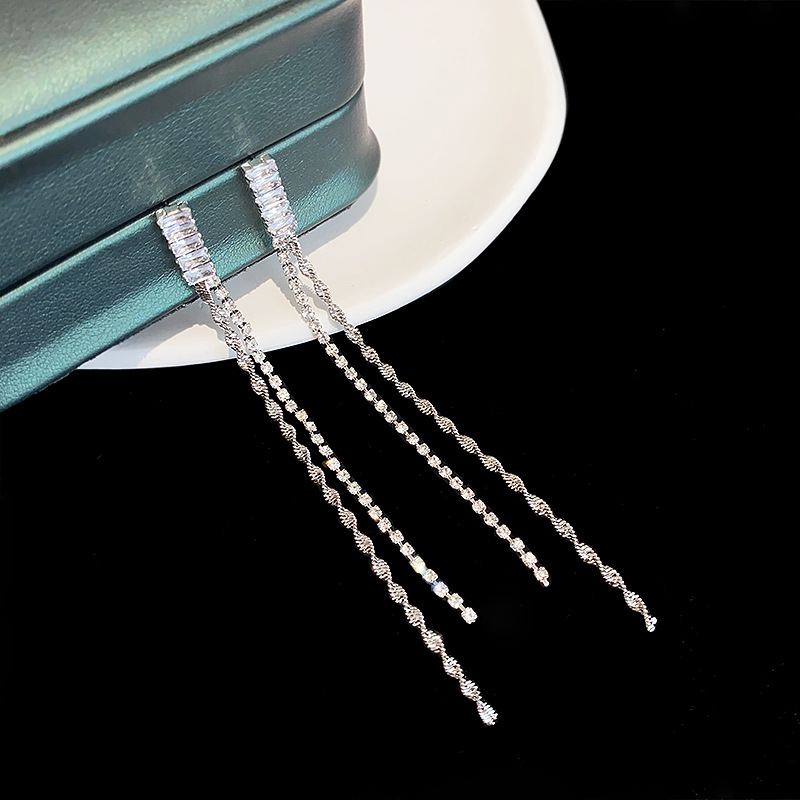 Elegant long earrings with zircon with tassels