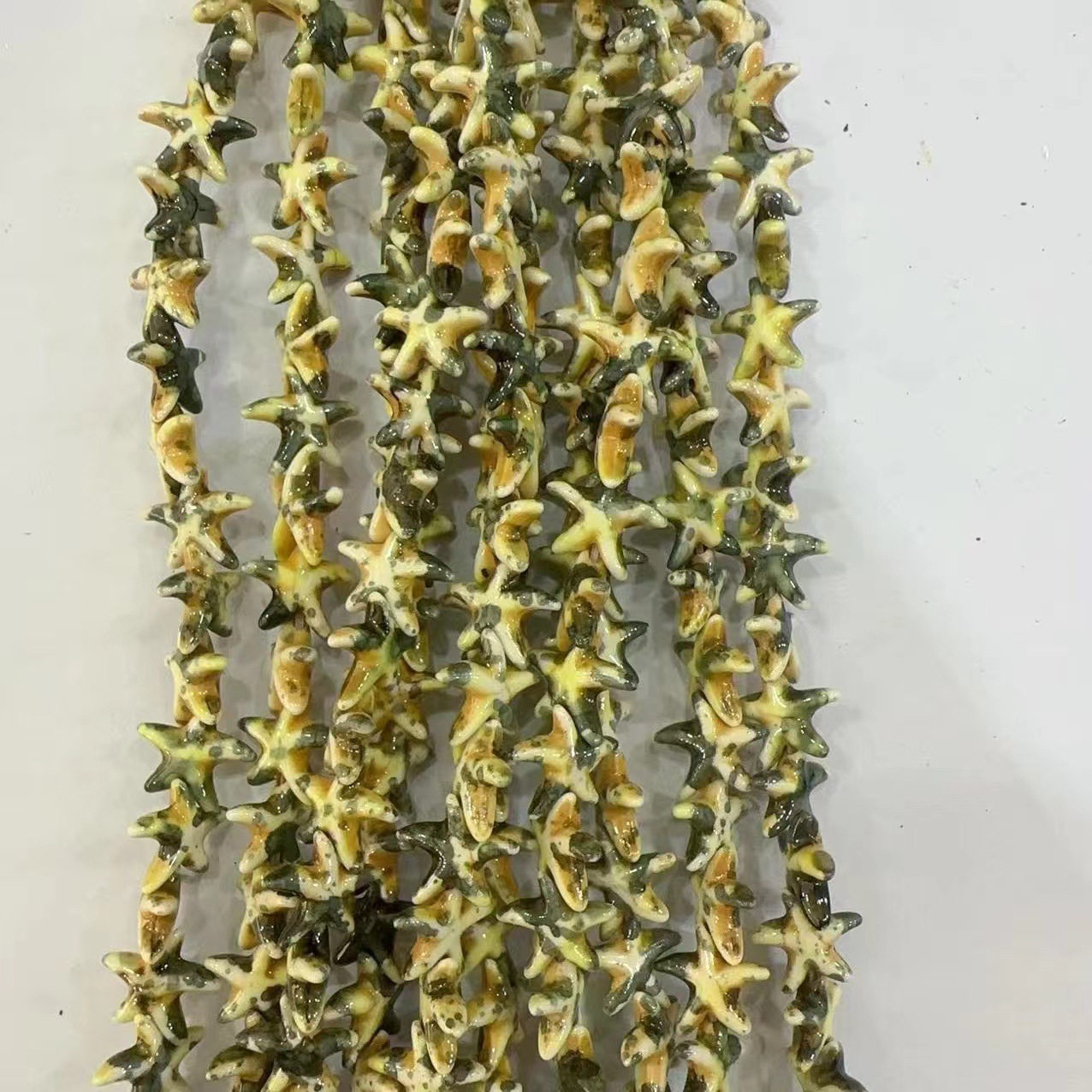 Ventas transfronterizas de coloridas estrellas de mar de piedra de pino cuentas semiacabadas DIY accesorios accesorios materiales de joyería hecha a mano