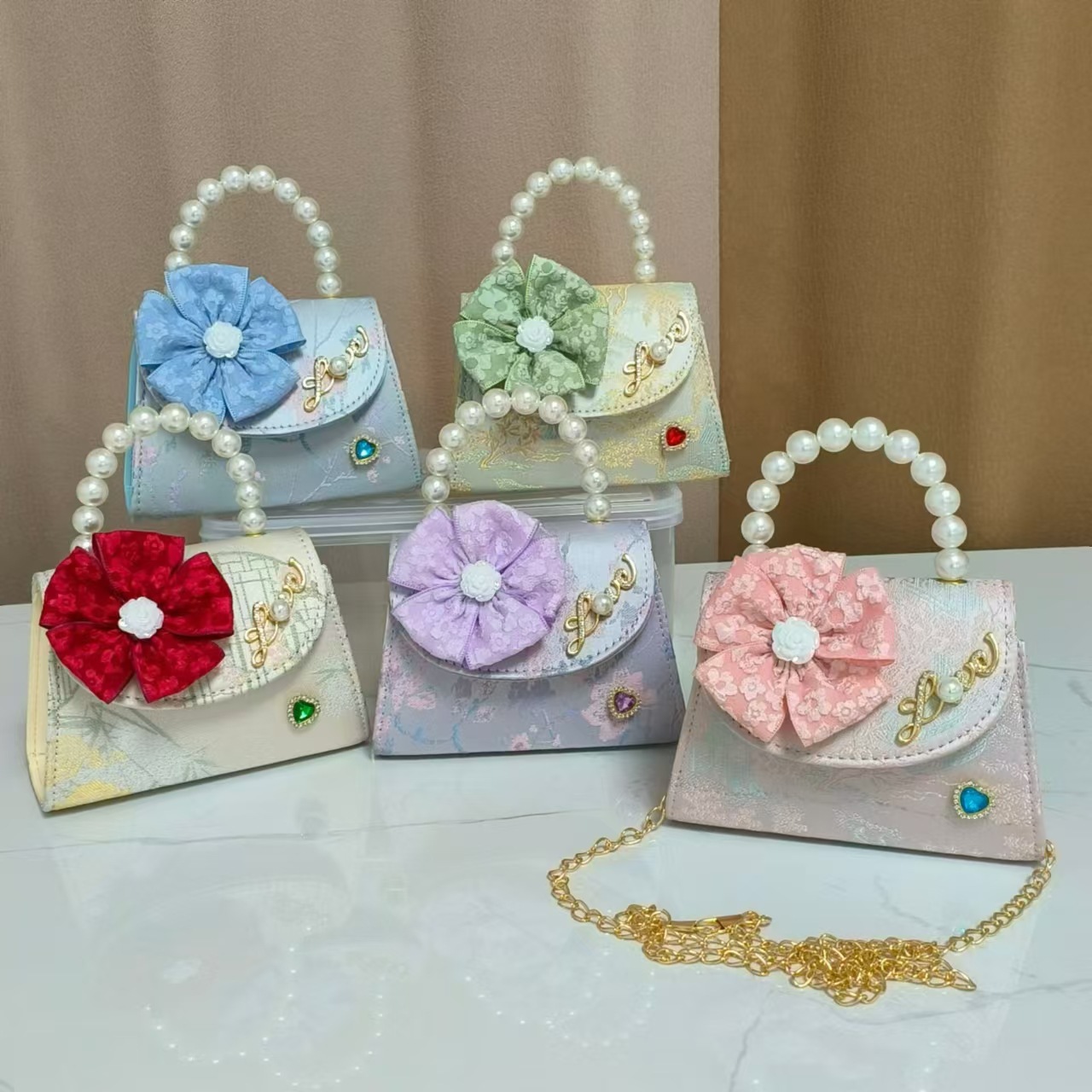 Bolsa infantil nueva niñas bolso de hombro accesorios de ropa china bolso cuadrado princesa bolso de perlas bolso arco bolso de mochila