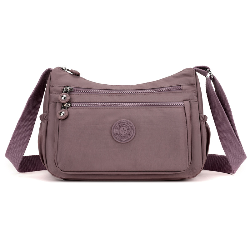 Bolsos bolsos para madres de mediana edad y ancianas 2024 nuevo bolso de mensajero de un solo hombro de tela de nailon bolso de bola de masa casual de viaje bolso de mujer