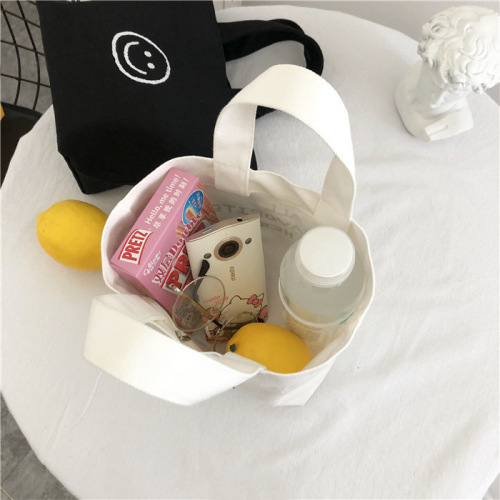 Korean Version 2025 New Smiling Face Ins Style Super Hot Canvas Bag for Girls Students Bento Mini Handbag Wholesale