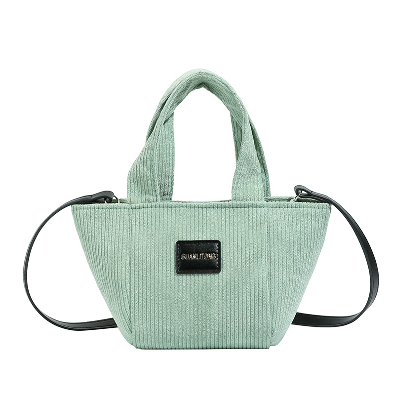2025 otoño y invierno nuevo tipo de bolsas de balde de niños de lana de gran capacidad bolsas de hombro de moda coreana bolsas de tela para niños de vellón