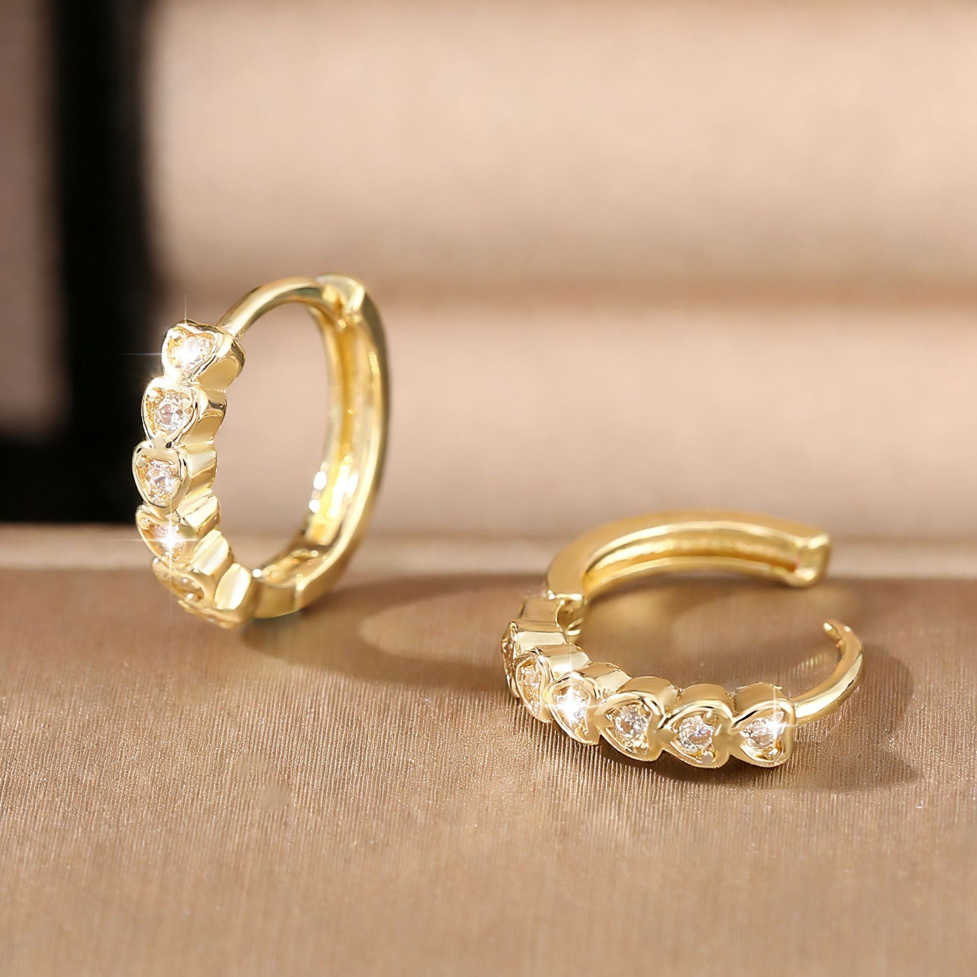 Shiny earrings with zircon heart shaped