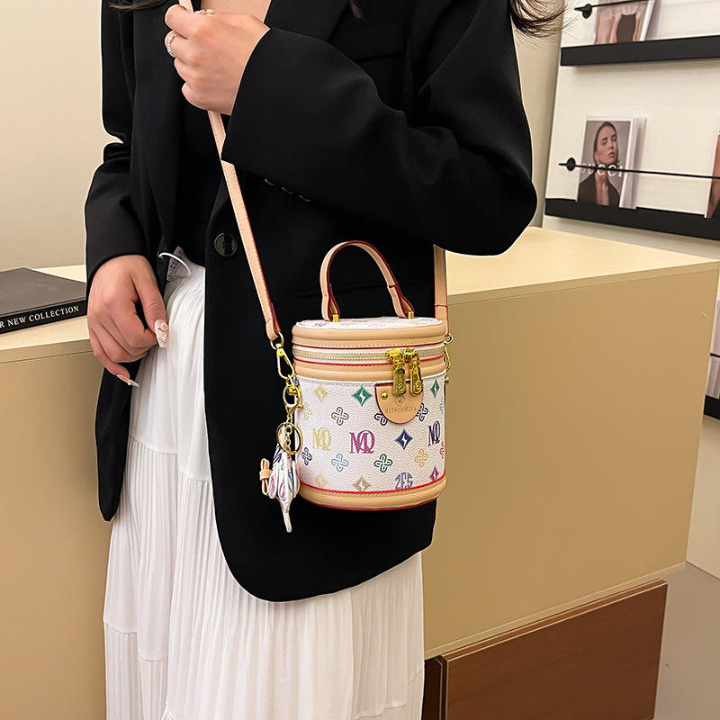 Bolso de cubo portátil con costuras de impresión retro transfronterizo para mujer 2025 nueva moda presbiteriana bolso de mensajero de un solo hombro para mujer
