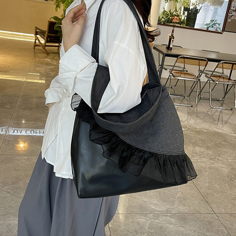 Versión coreana del bolso de nicho 2025 verano nuevo bolso femenino bolso de encaje lindo bolso de hombro de color de contraste de gran capacidad