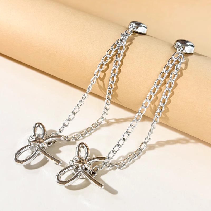 Esquina de la camiseta, peldaño apretado, artefacto corto, botones de nudos, mangas fijas, pantalones fijos, pies, cadena anti-flip, botones de succión magnéticos