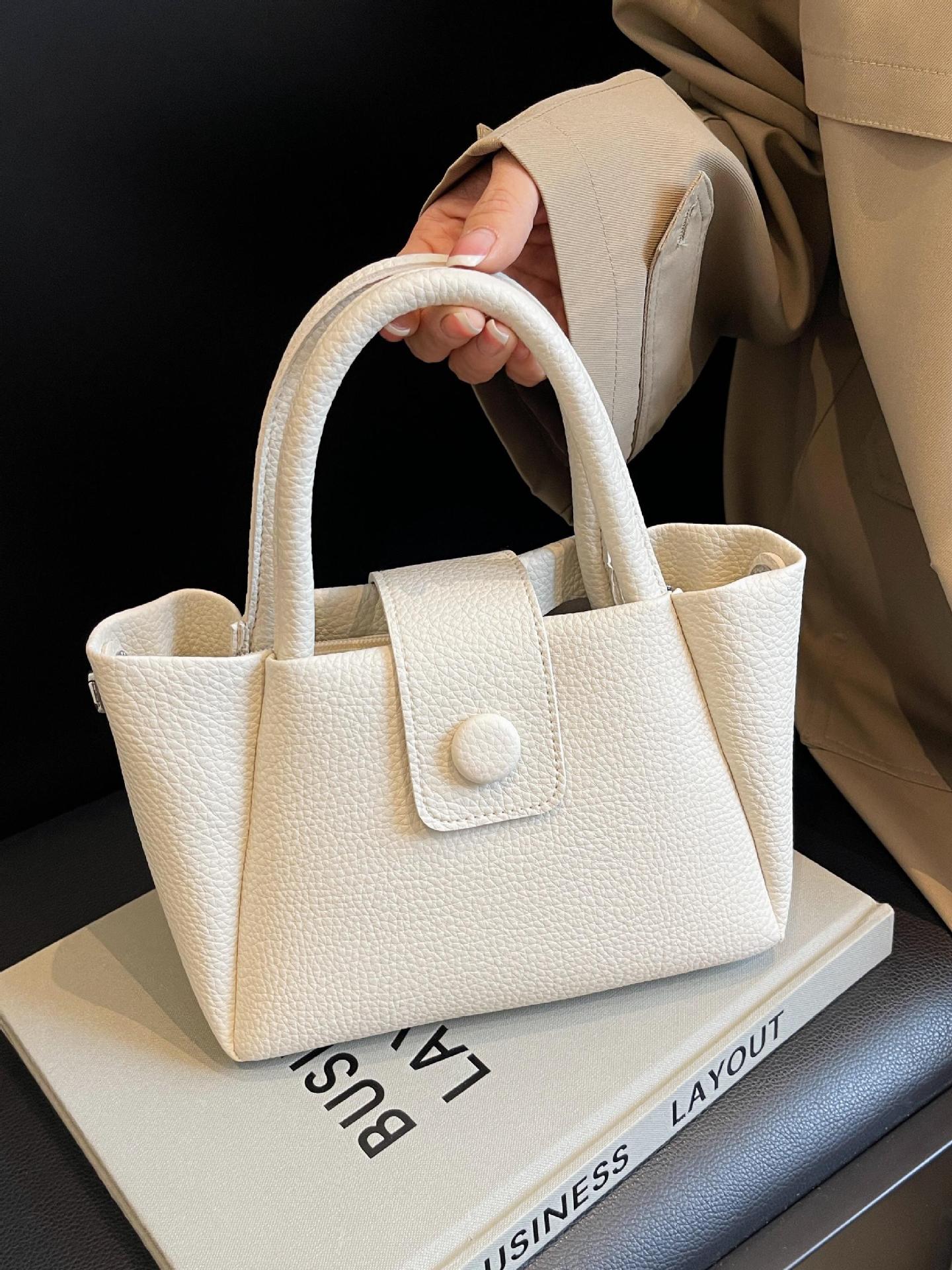 Bolso de mano de comercio exterior para mujeres 2025 nuevo tipo de bolso de mochila simple casual de moda versátil de alta calidad bolso de cubo de hombro