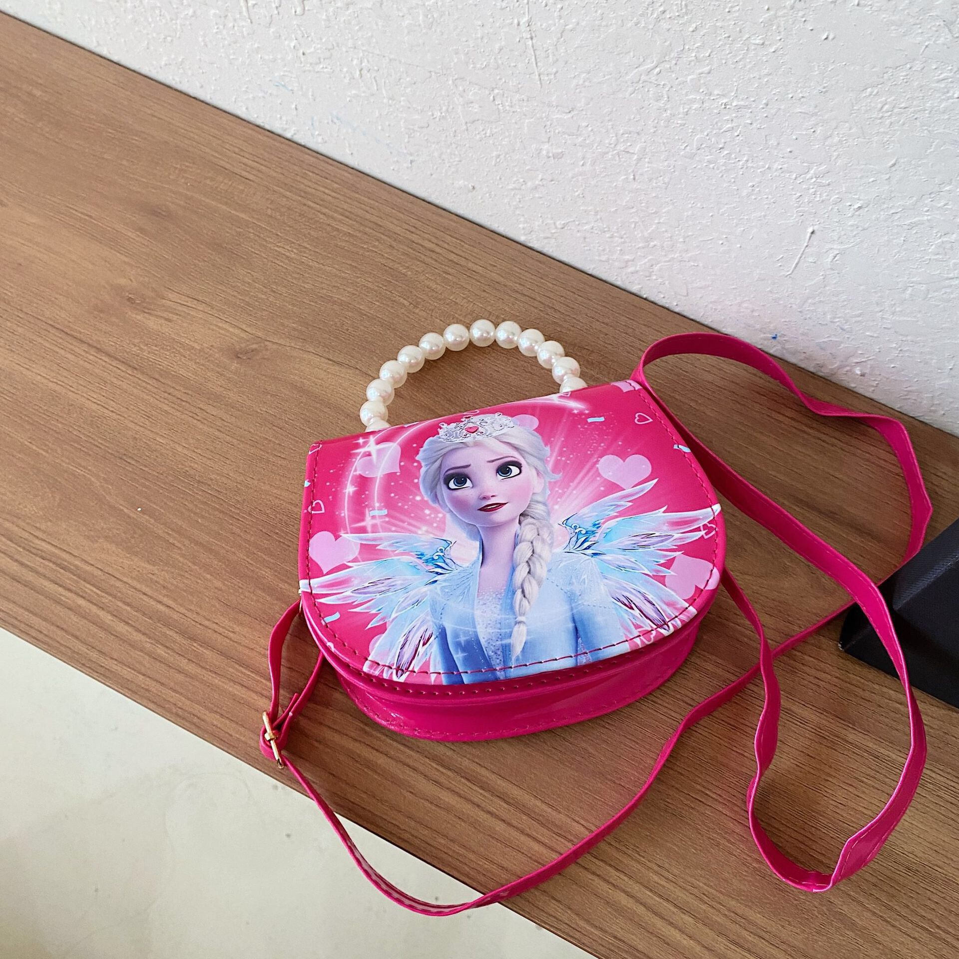 2024 nueva bolsa de hombro para niños princesa Elsa dibujos animados Yue Gui perro coreano nicho perla bolsa de mano inclinada
