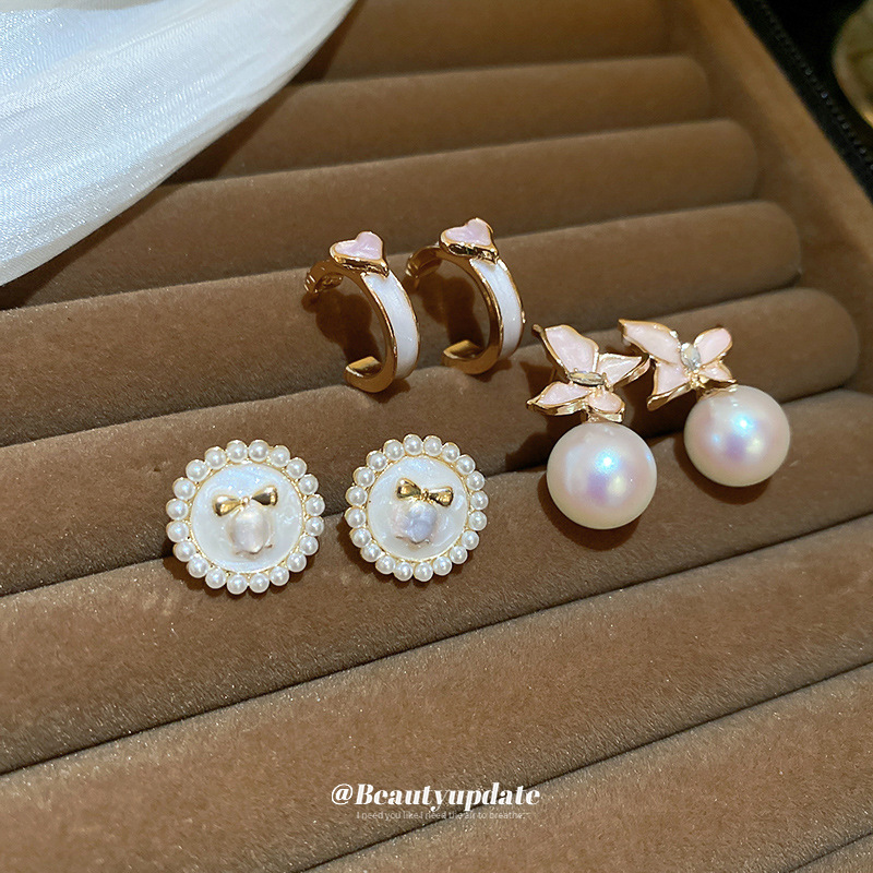 Aguja de plata Pendientes de perlas de flores de aceite que gotea rosa Pendientes de moda retro francesa súper hada Pendientes de lujo ligero de alta gama Mujeres