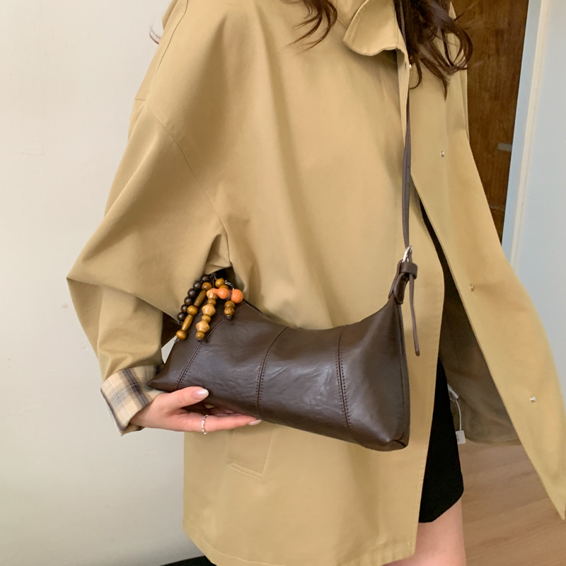 Bolsa de brazo retro transfronteriza para mujeres otoño y invierno 2025, nueva moda de nicho popular, bolsa de hombro universal, bolsa de transporte