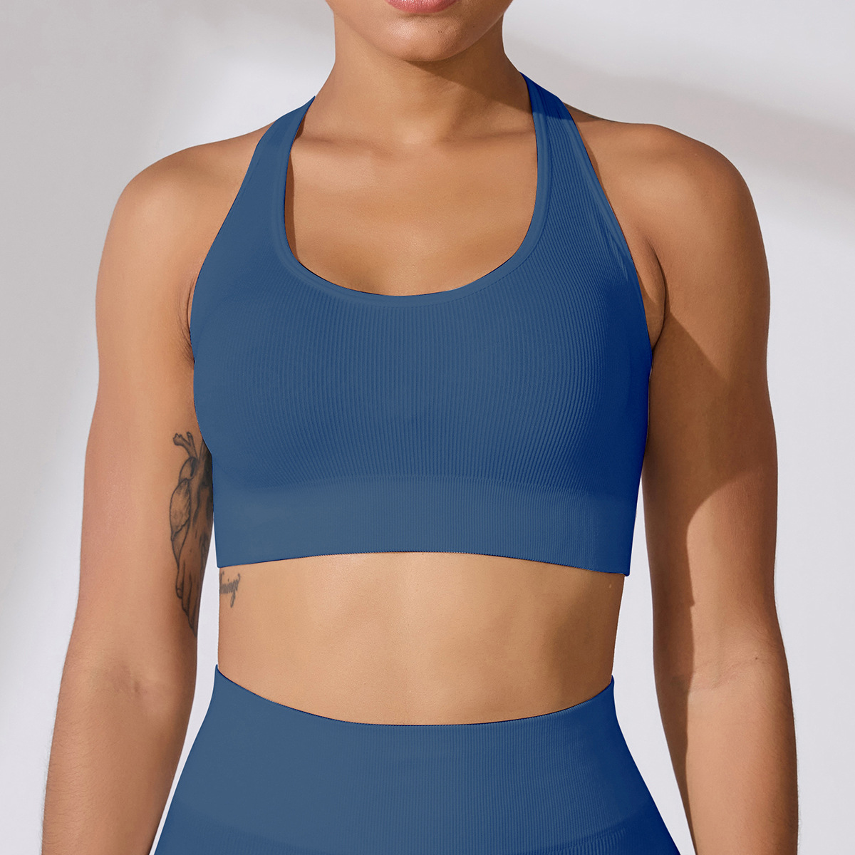 Sujetador deportivo de alta intensidad para mujer, superventas transfronterizo en Europa y América, a prueba de golpes, con espalda hermosa, copas fijas, tipo top de yoga