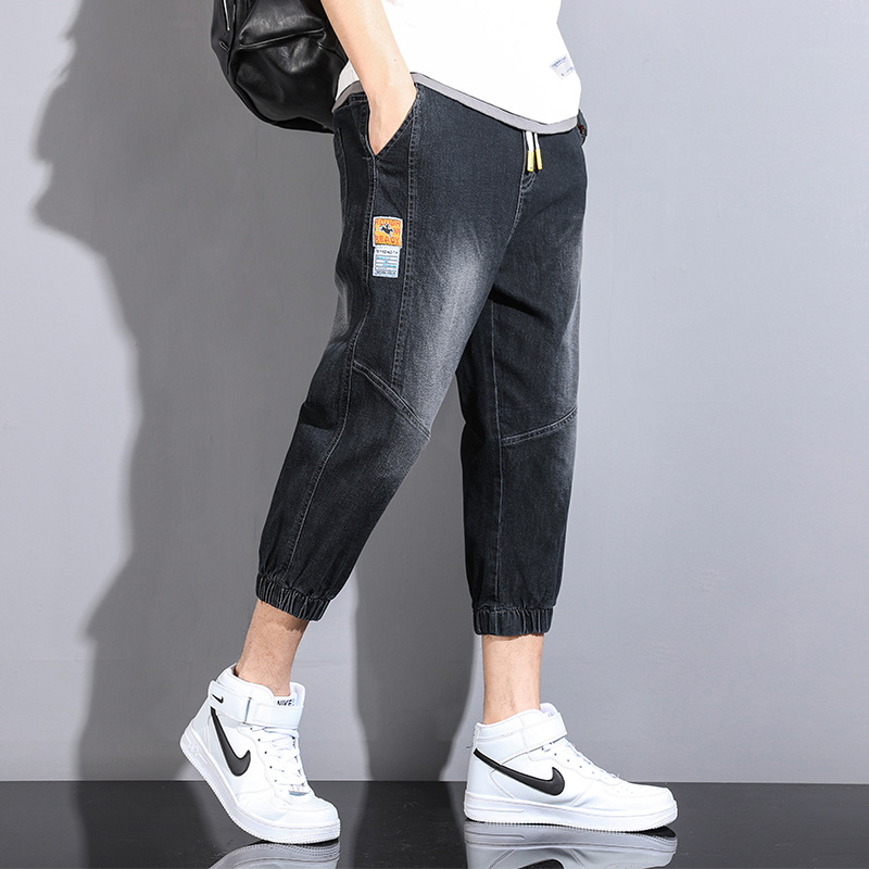 Comercio exterior cortar la etiqueta ropa de hombre suelta pie abrazado siete puntos jeans cintura elástica cuerda de dibujo de verano juvenil ocio pantalones harun moda