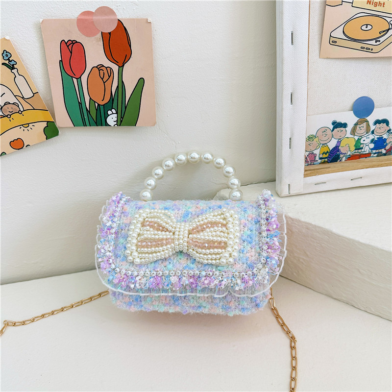 2025 primavera nuevo estilo lentejuelas lazo de perlas niña princesa mano mano accesorios diagonales bolso monedero