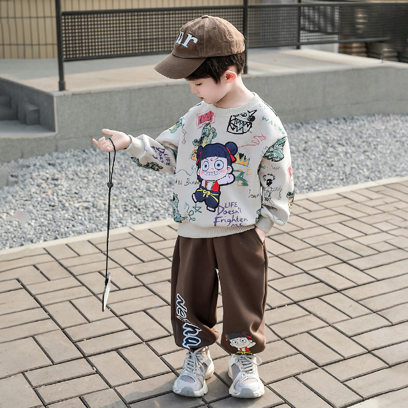 7779 Traje de dibujos animados de graffiti para niños 2025 Nuevo estilo Niños pequeños y medianos Cuello redondo Traje de dos piezas Bebé Ropa casual para niños