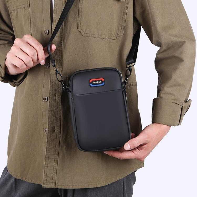 Bolso de tendencia multifuncional simple de almacenamiento casual nuevo bolso de mochila de moda simple bolso de teléfono móvil de hombre