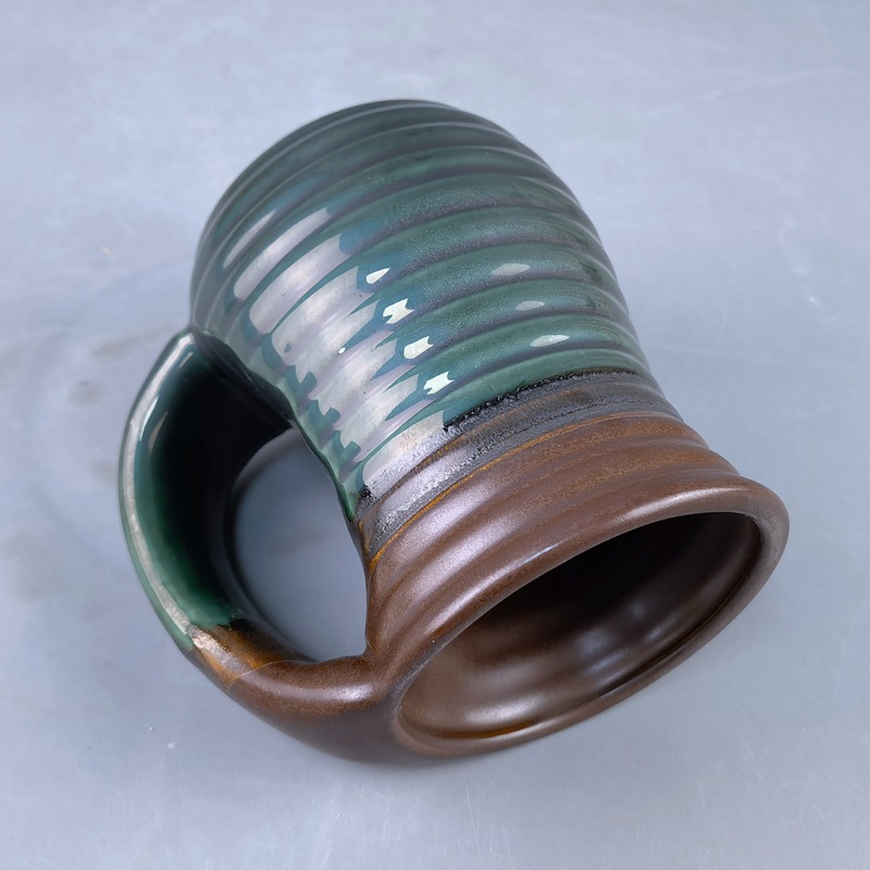 Gran capacidad de cerámica calentadora de mano marca taza de agua creativa horno transfronterizo esmaltado empuje de bolsillo taza de piedra de mano derecha