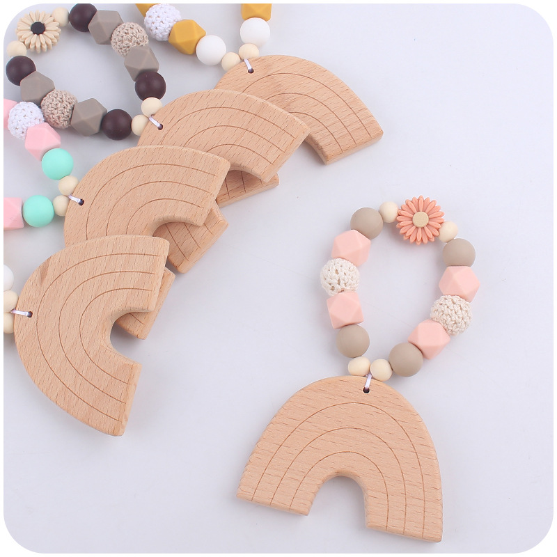 Nuevo bebé suministros dibujos animados Arco Iris haya mordedor creativo DIY bebé mordedura teether pulsera juguete