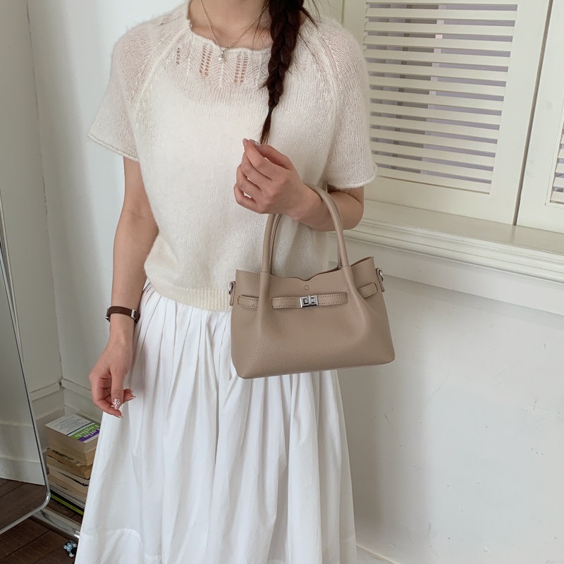 Simple portátil 2026 diseño de bolso de hombro único versátil estilo coreano de transporte de moda nuevo bolso de cubo nicho femenino