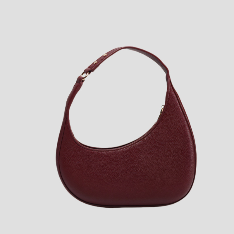 2025 nuevo diseño de nicho de moda europea y americana, bolso de luna creciente irregular en forma de media luna, bolso de axila de alta gama, mujer