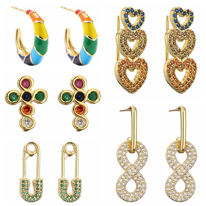 Transfronterizo nuevo cobre europeo y americano chapado en oro Cruz aretes diseño femenino sentido nicho personalidad amor pendientes