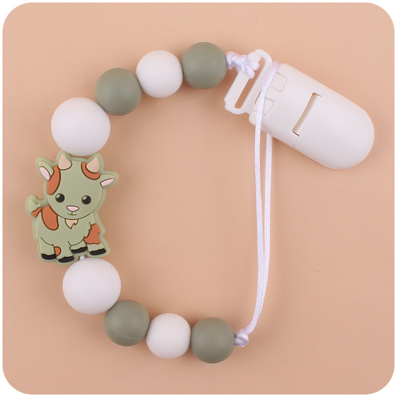 Nuevo bebé suministros chupete cadena creativa de dibujos animados Cordero silicona bebé mordedura cadena anti-gota molar