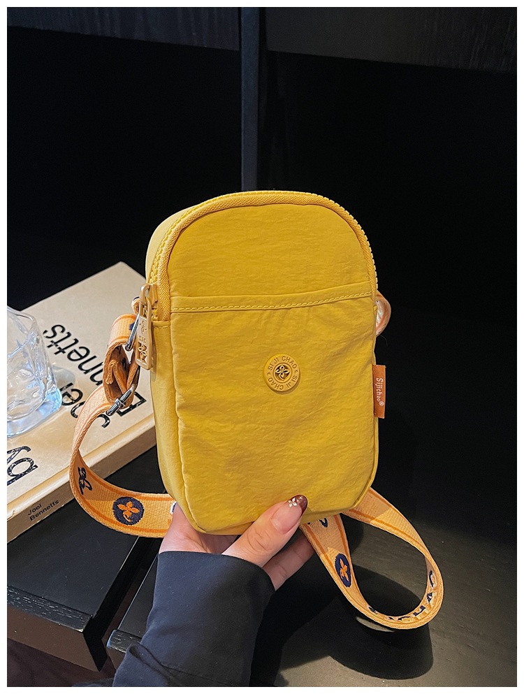 Bolso de nylon de moda para mujeres 2026 nuevo bolso de teléfono móvil ligero casual simple bolso de transporte de viaje