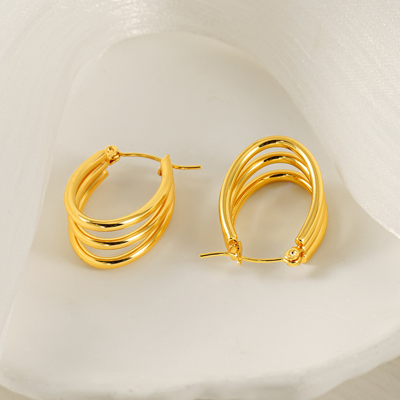 Pendientes circulares multicapa europeos y americanos transfronterizos Pendientes de acero de titanio simples y versátiles Pendientes de acero inoxidable en forma de U