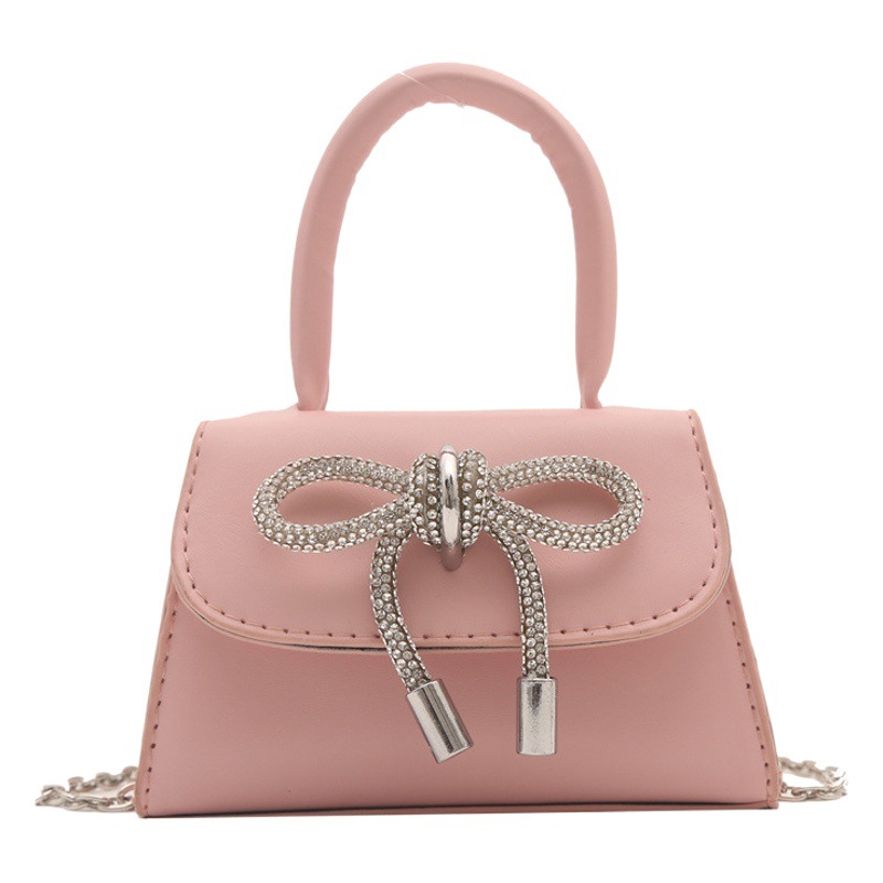 Alta textura estilo Chanel color sólido arco pequeño cuadrado bolso de las mujeres 2023 invierno nueva cadena crossbody del hombro