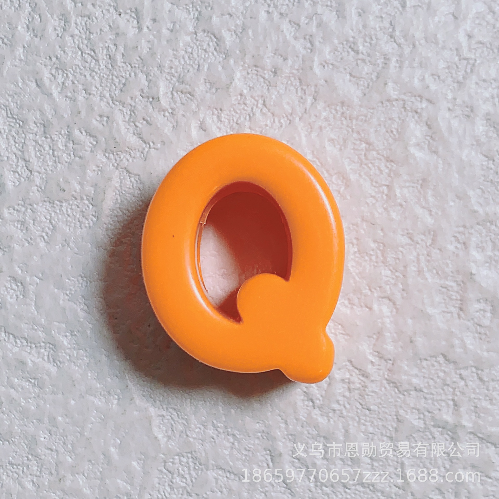 Q (Orange)