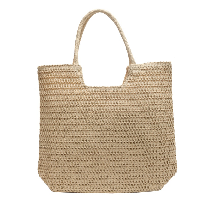 Verano simple y popular bolso de paja femenino 2025 nuevo estilo estilo occidental tejido bolso de playa bolso de viaje de gran capacidad