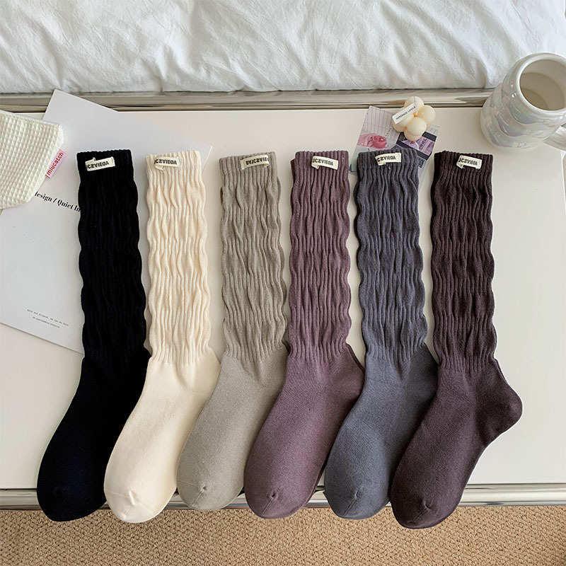 Solid color pile socks women's mid-calf socks ins autumn and winter pleated bubble Japanese ballet style personalized cloth label calf socks