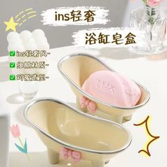 蝶結びの石鹸の箱の家庭用トイレのテーブルの上で水を切ります。石鹸の箱は軽くて豪華で可愛いです。