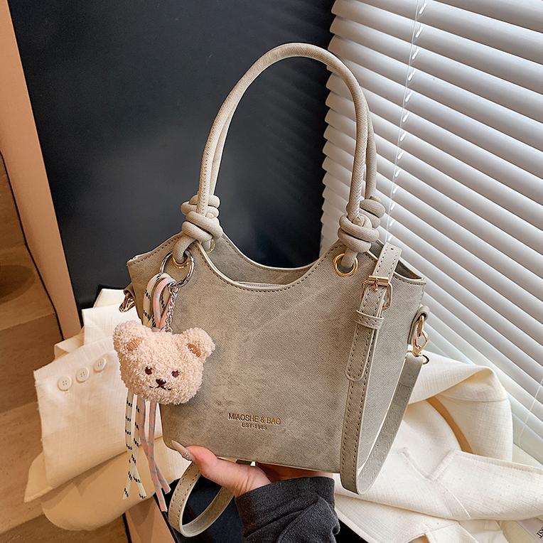 Corea del Sur ins moda bolso de cubo de mano 2025 nuevo estilo simple ocio versátil bolso de hombro textura superior