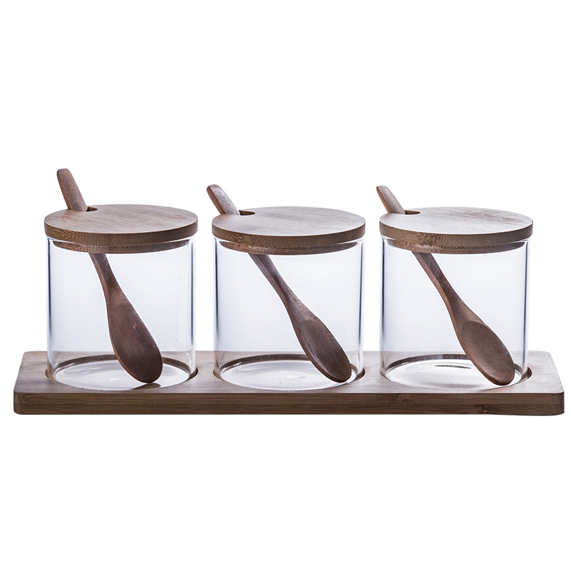 Fábrica al por mayor tarro de condimento de vidrio borosilicato traje fregona de bambú con cuchara frasco de condimento de esencia de pollo combinación creativa caja de condimento