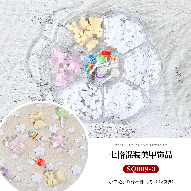 Seven-grid mixed Camellia nail jewelry bow flat diamond lollipop nail pequeña bola de acero Pearl Square Diamond