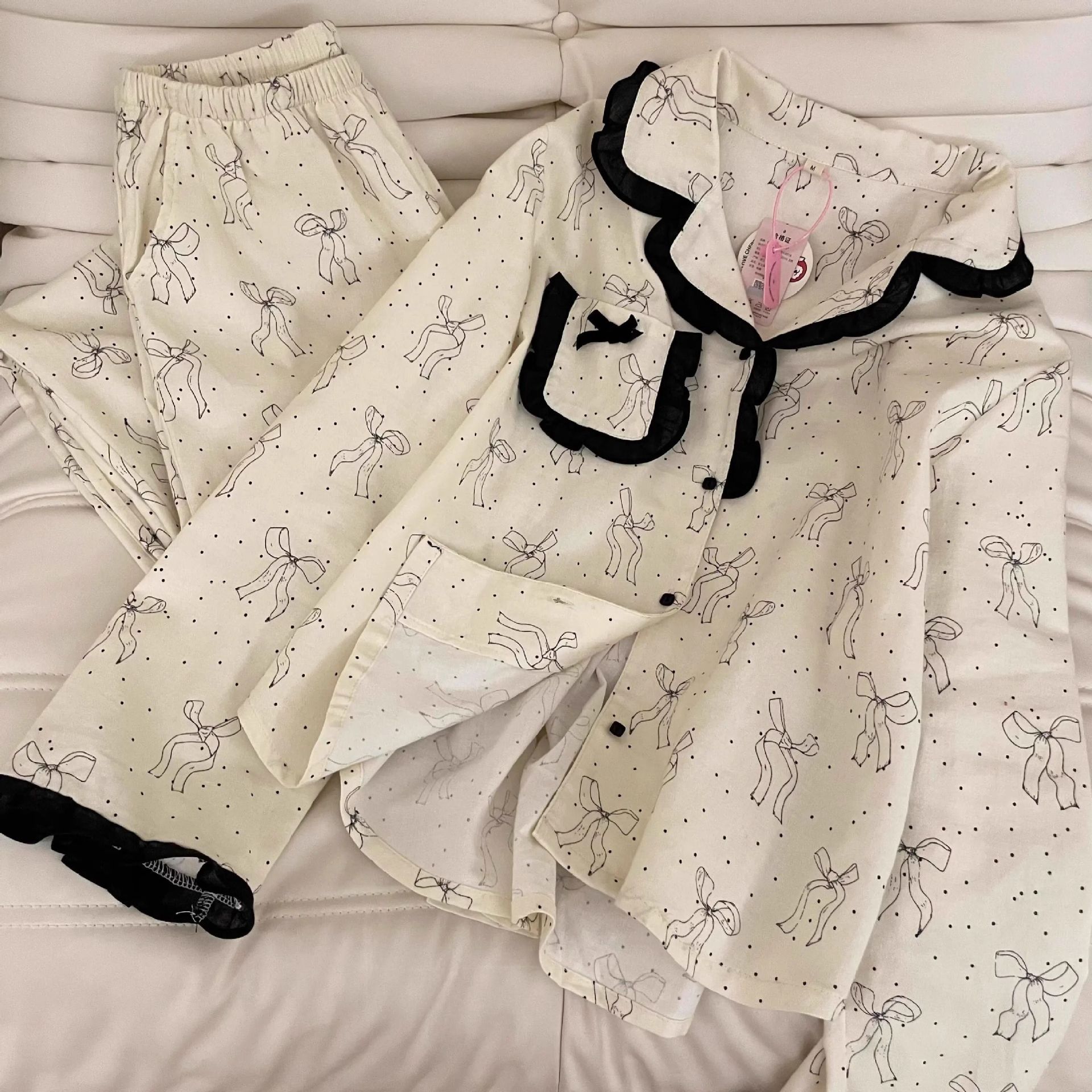 Venta al por mayor transfronteriza de orejas de madera nuevos pijamas explosivos lunares lazo dulce niña servicio a domicilio primavera y otoño pantalones de manga larga