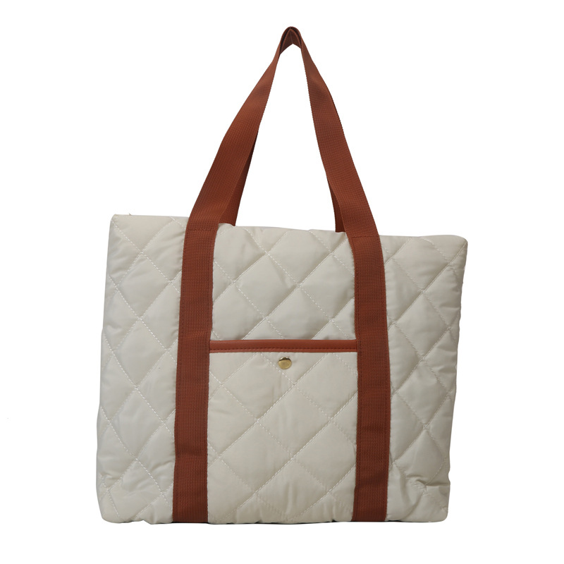 Bolsa de ropa de algodón, bolso de pluma de algodón de mujer, bolso coreano ligero 2025, nuevo estilo de aire extranjero, bolso de hombro de gran capacidad.