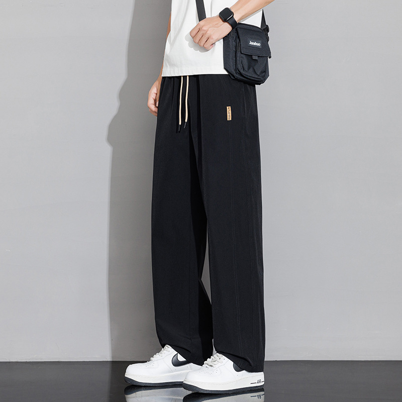 Pantalones casuales recto de tamaño grande para hombres 2026 nuevo verano delgado hielo suelto para aumentar el peso de los pantalones deportivos para hombres