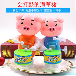 New spring drum beating seaweed pig drum winding large cartoon pig man stall night market children's toys wholesale