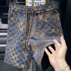 夏の男性の新型プリントの三角の格好いい個性の半ズボンのファッションは合わせて流行します。
