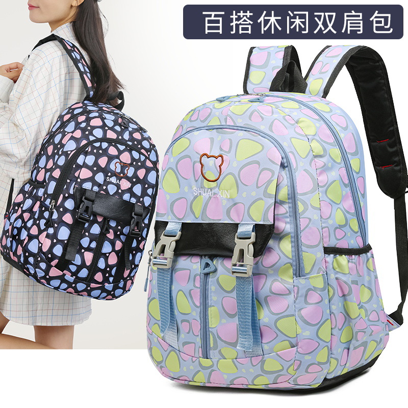 Fábrica al por mayor nueva mochila escolar de estudiantes de primaria y secundaria, mochila ligera de ocio de gran capacidad, mochila de viaje de bolsillo