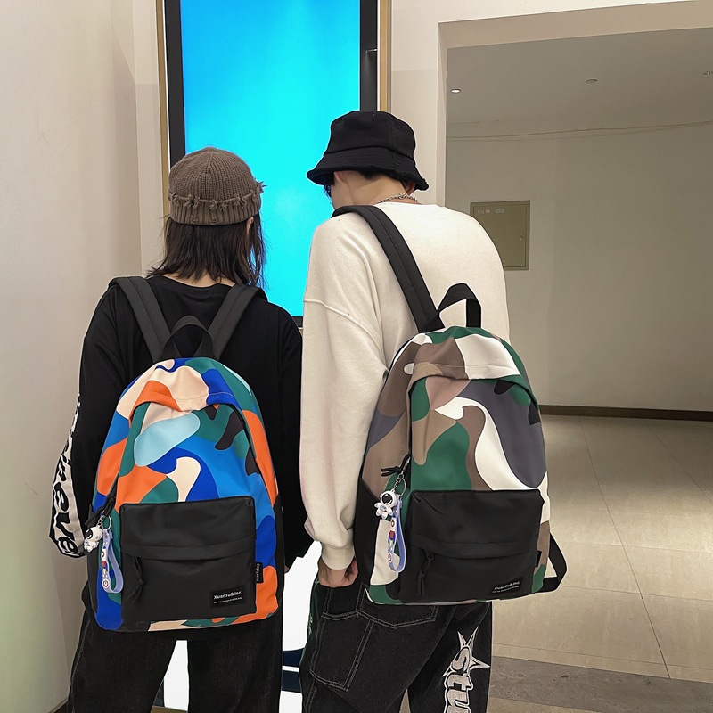 韩版风范彩色艺术涂鸦印花拼接黑底学生男女书包街头时尚双肩背包