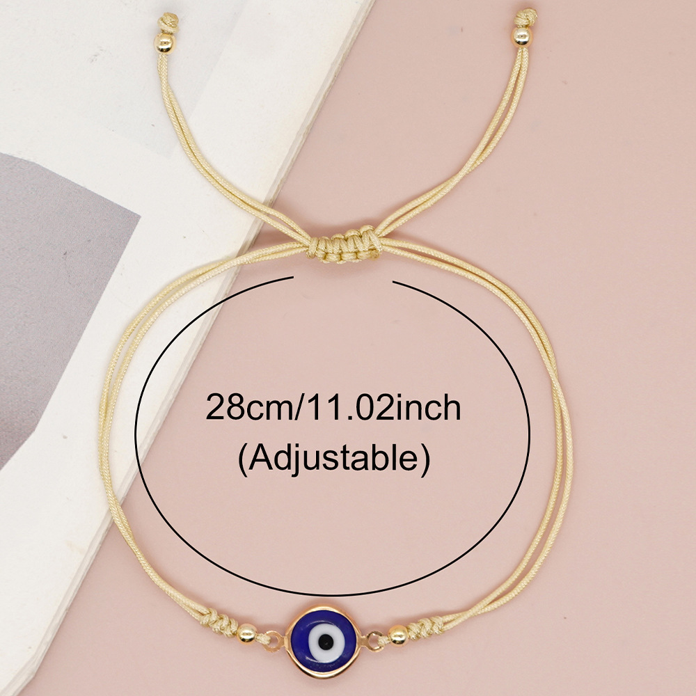 Pulseira de berloques olho grego com contas douradas_voghion.com