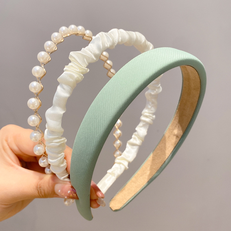 A principios de la primavera, la banda de cabello para mujeres en línea, 2025 nuevo lavado de cara de presión de tarjeta de cabello para el cabello, banda de cabello de perlas, banda de cabello para mujeres.